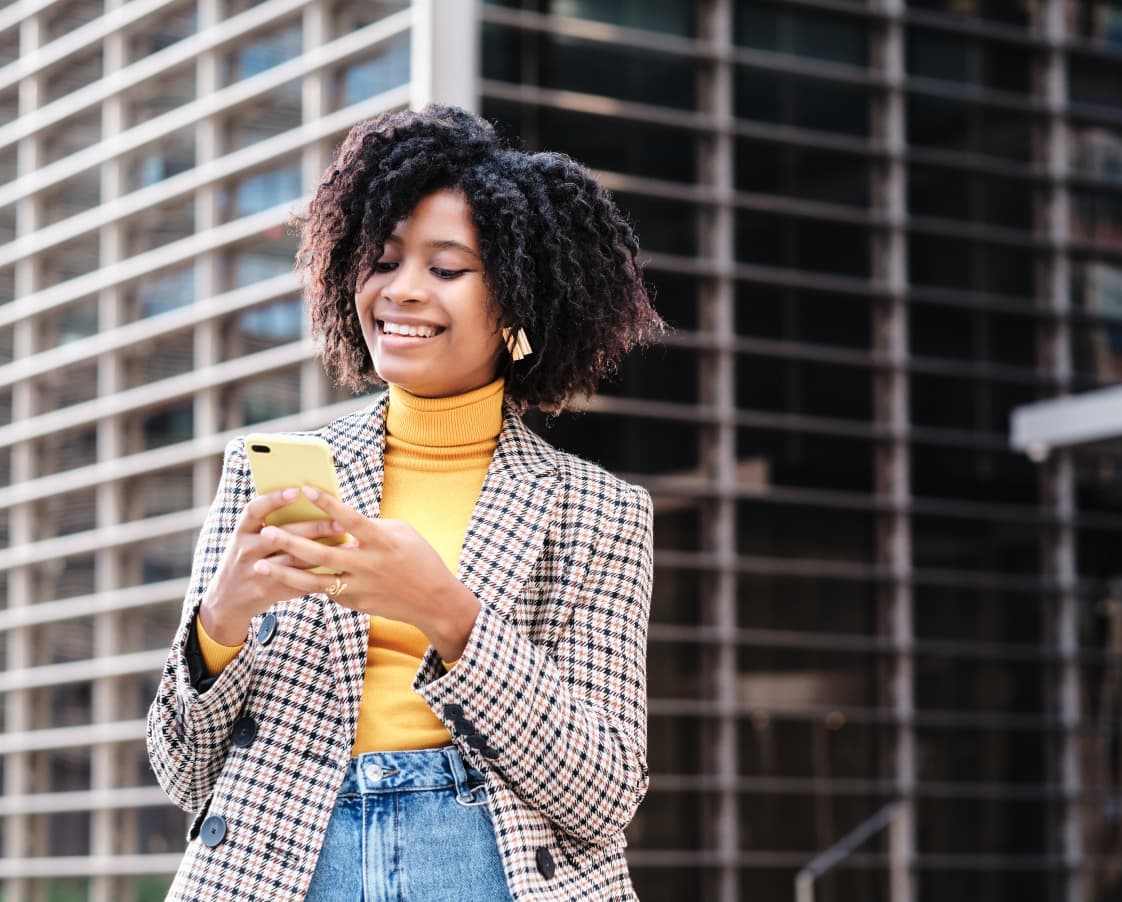 business-woman-using-her-phone-outdoors-2022-10-11-19-26-17-utc